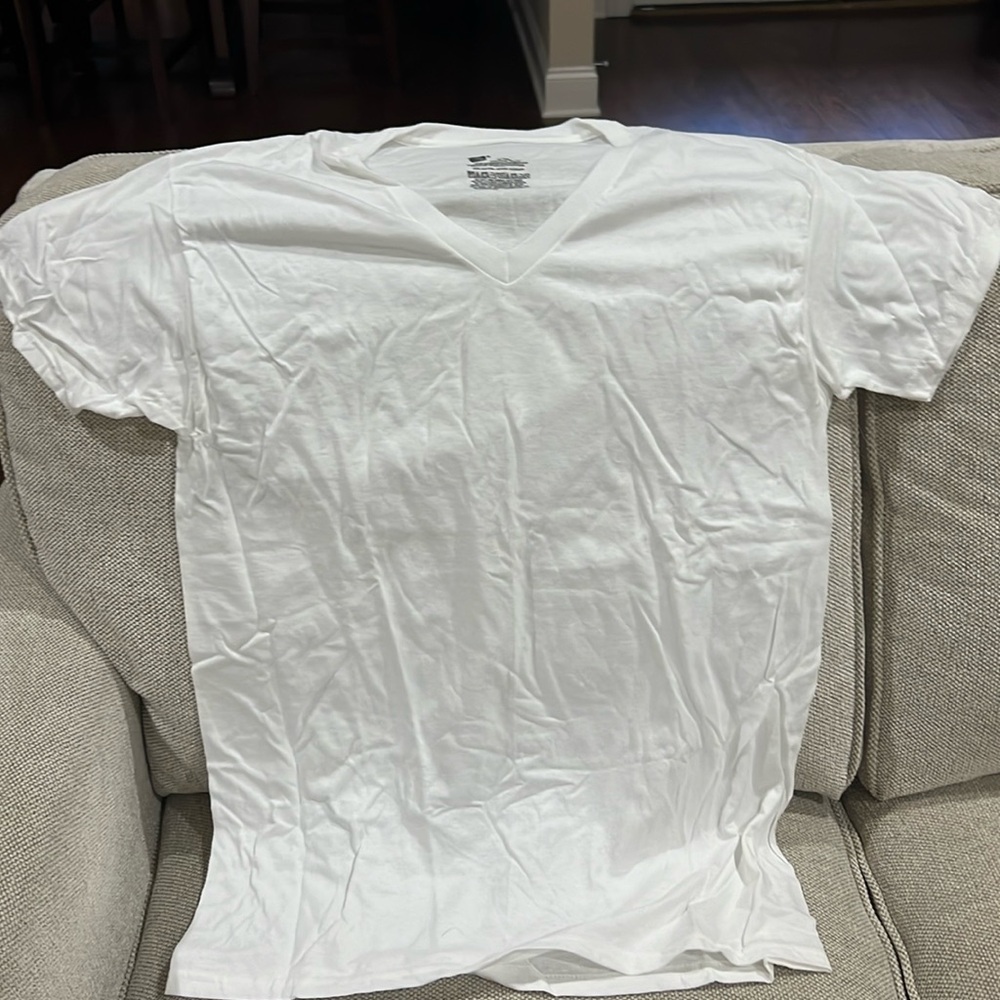 Three white v-neck Hanes undershirts size M